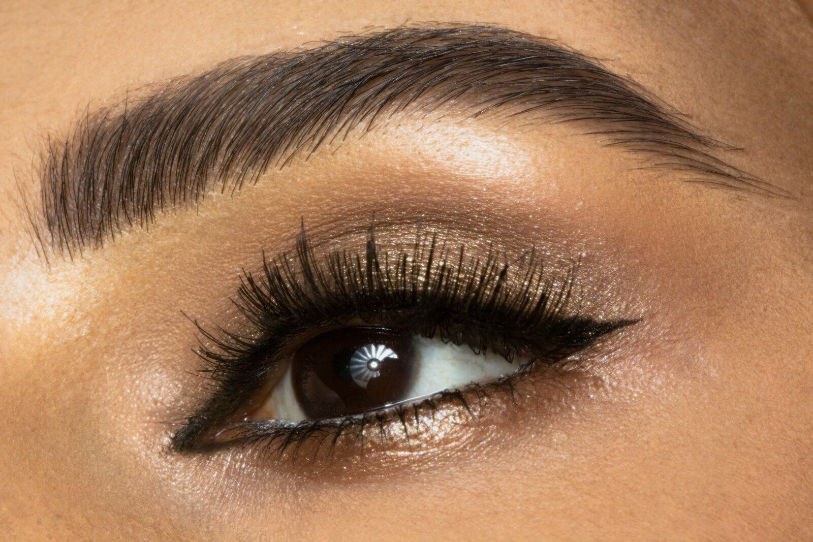 Photo by Aditya Saxena a close up of a woman's eye with long lashes